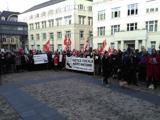 People listening to public speeches in the precinct of the Court